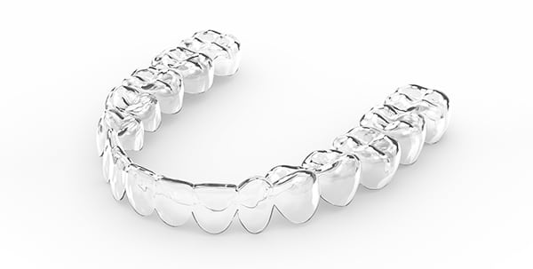 Clear retainer aligner on white background | Troy City Orthodontics in Fall River, MA